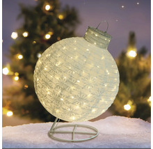 Glob decorativ de Crăciun, iluminat, cu model de fulgi de zăpadă pe un suport