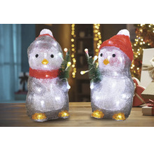 Două figurine pinguin cu iluminare și brazi de Crăciun ca decorațiuni