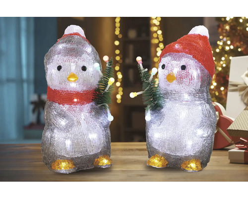 Două figurine pinguin cu iluminare și brazi de Crăciun ca decorațiuni