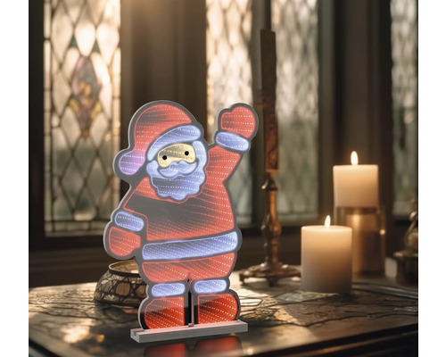 Figurină decorativă LED Moș Crăciun pe o masă