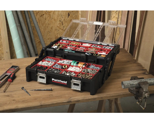 Cutie sortiment Pattfield deschisă pe o masă de lemn cu șuruburi și cuie