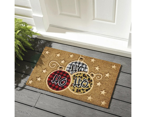 Covoraș de ușă cu design de glob de Crăciun în fața unei uși