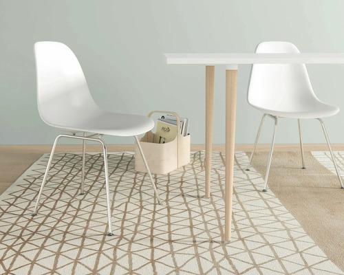 Sufragerie cu masă, scaune și covor cu design modern.