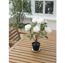 Trandafir artificial decorativ în ghiveci pe o masă de lemn