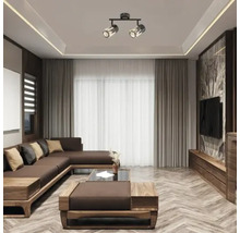 Living modern cu canapea de colț maro, podele din lemn și plafonieră