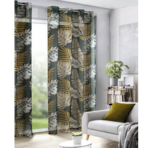 Șaluri decorative cu model de frunze în fața ferestrei într-o sufragerie