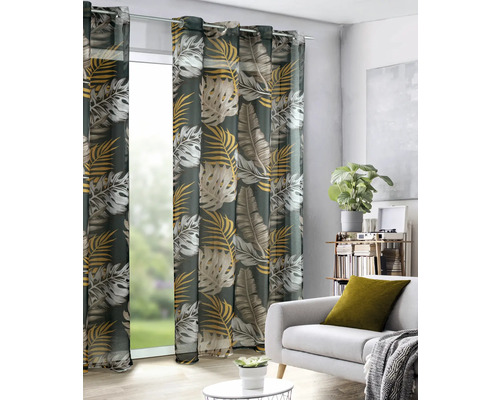 Șaluri decorative cu model de frunze în fața ferestrei într-o sufragerie