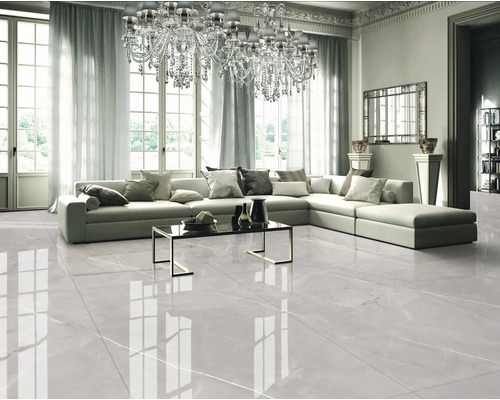 Living luminos cu canapea mare și gresie cu aspect de marmură