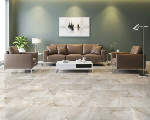 Cameră de zi cu podea de gresie, canapea și fotolii