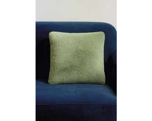 Pernă decorativă verde pe canapea albastră