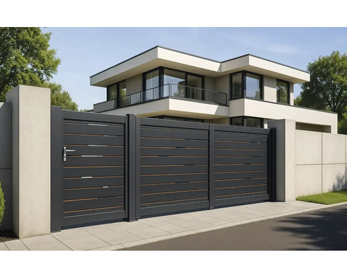 Aspect modern al casei cu poartă glisantă și elemente de gard