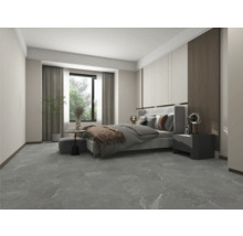 Dormitor luminos cu pat, noptieră și podea de piatră gri