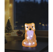 Figurină decorativă LED vulpe din acril cu lumină albă caldă într-o atmosferă de Crăciun pe o masă în fața unei ferestre.