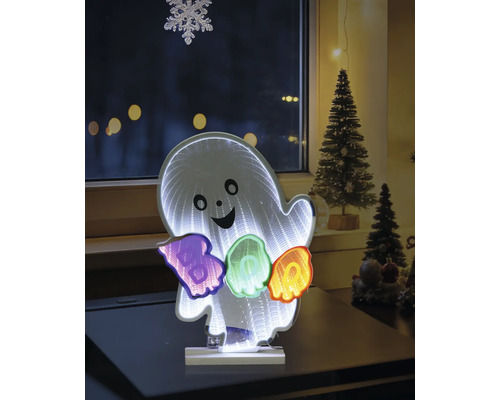 Decorațiune LED Halloween fantomă cu efect de oglindă infinită și inscripția BOO colorată, așezată pe o masă într-o cameră.