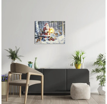 Living modern luminos cu tablou pe pânză cu LED cu Moș Crăciun și animale în zăpadă, suspendat deasupra unei comode cu plante de interior.