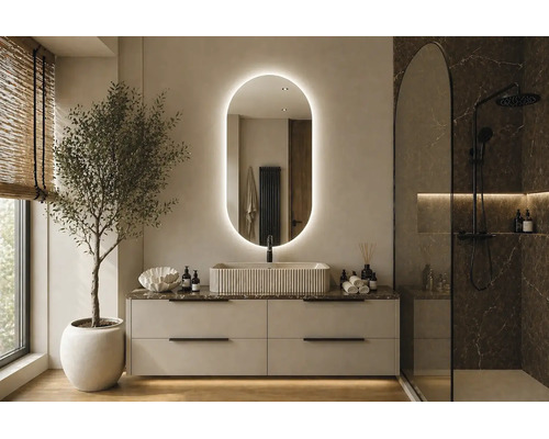 Baie modernă și luminoasă, cu oglindă ovală iluminată, lavoar pe blat canelat și duș negru de tip walk-in.