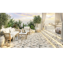 Terasă modernă cu plăci de terazzo, mobilier de lounge confortabil, vatră de foc și iluminat LED ambiental într-un spațiu exterior elegant.
