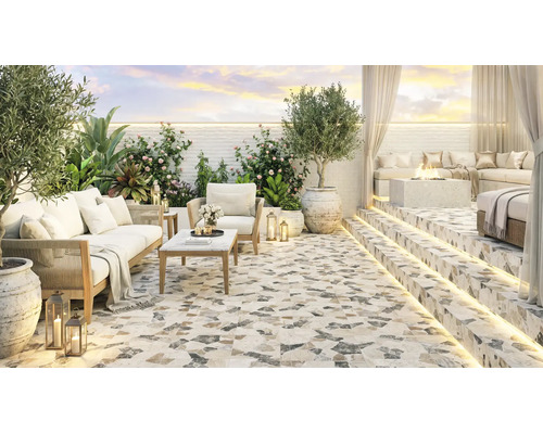Terasă modernă cu plăci de terazzo, mobilier de lounge confortabil, vatră de foc și iluminat LED ambiental într-un spațiu exterior elegant.