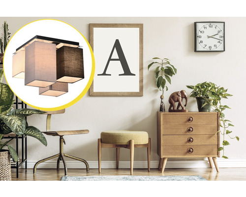 Plafonieră cu abajur textil într-o cameră cu mobilier