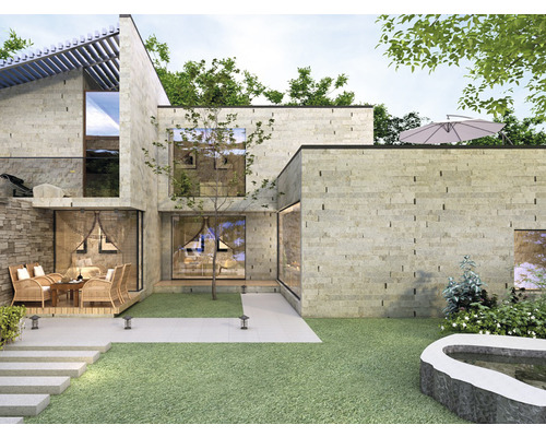 Casă modernă cu fațadă din piatră, grădină și terasă cu zonă de relaxare.