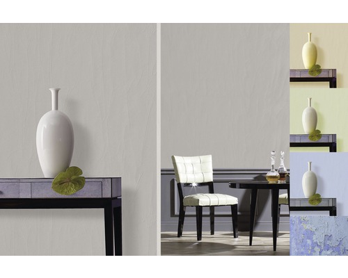 Cameră luminoasă cu decor modern, inclusiv o masă, un scaun și o vază