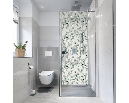 Baie modernă cu toaletă și cabină de duș cu model vegetal