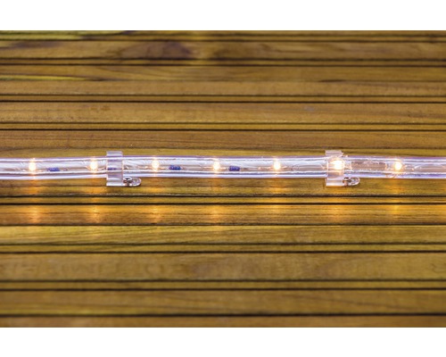 Furtun luminos cu LED cu suport pe fundal de lemn