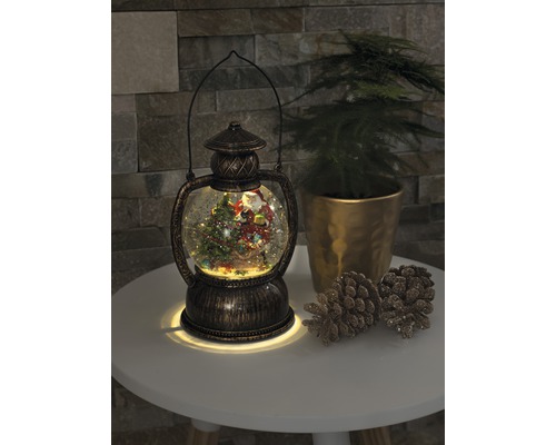 Lanternă decorativă glob de zăpadă cu motiv de Crăciun și iluminare.