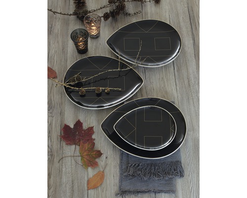 Aranjament decorativ cu farfurii negre cu modele geometrice