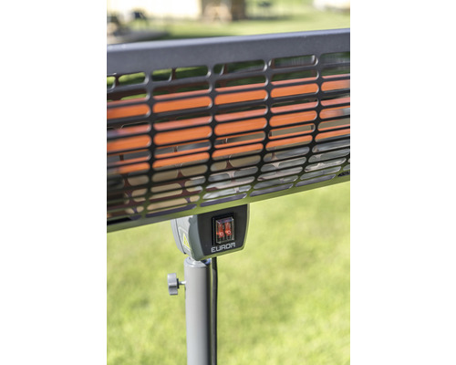 Imagine detaliată a unui încălzitor cu grilaj de protecție și comutator