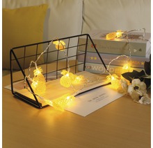 Ghirlandă luminoasă decorativă cu lumini în formă de ananas pentru o atmosferă primitoare.