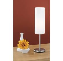 Lampă de masă decorativă cu vază și floare pe o masă