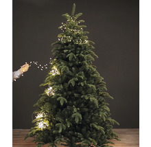 Brad artificial de Crăciun decorat cu ghirlandă luminoasă