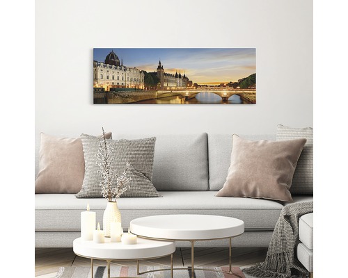 Imagine de perete cu o priveliște nocturnă a orașului Paris deasupra unei canapele