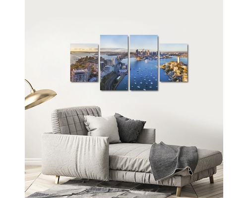 Tablou de perete din patru piese cu vedere spre oraș deasupra canapelei