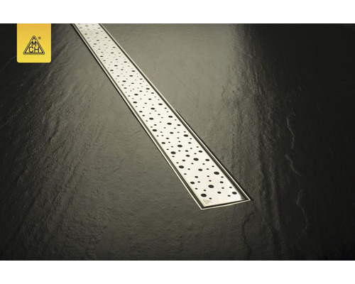 Canal de duș din oțel inoxidabil cu model perforat pe fundal întunecat