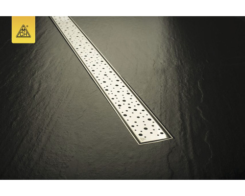 Canal de duș din oțel inoxidabil cu model punctat pe un fundal întunecat