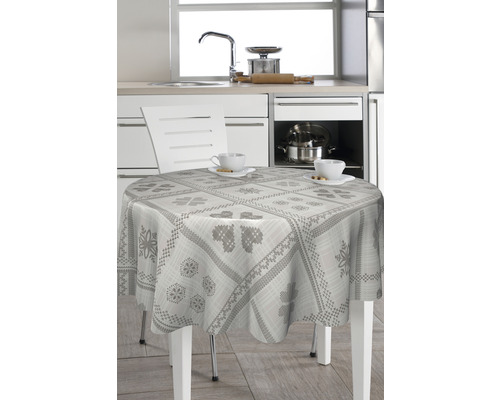 Masa cu față de masă rotundă în decor de bucătărie