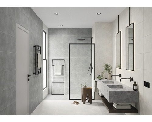 Baie modernă cu gresie gri, duș, lavoar și accente negre pentru o ambianță elegantă.