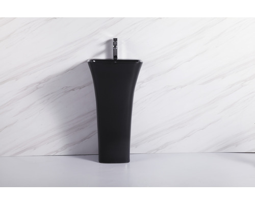 Lavoar negru pe piedestal cu robinet în fața unui perete