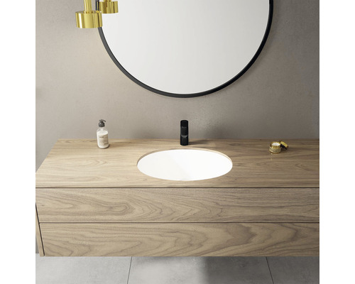 Baie modernă cu dulap sub lavoar, lavoar aplicat și oglindă rotundă