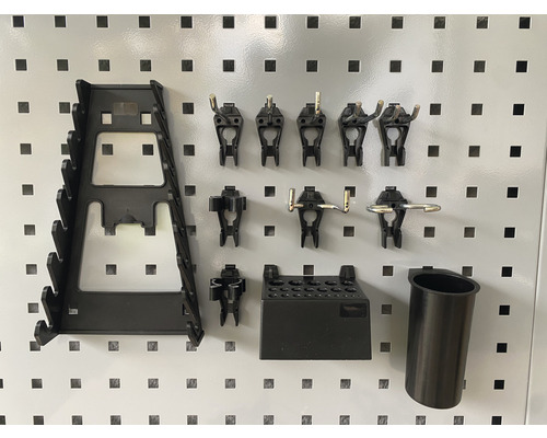 Set de accesorii pentru panoul de scule, compus din cârlige, suporturi și compartimente de depozitare pentru montare pe perete