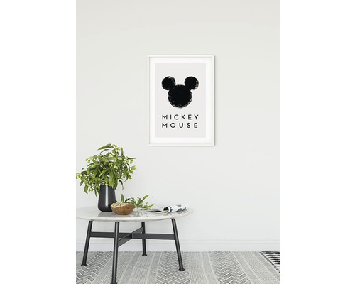 Imagine decorativă cu silueta lui Mickey Mouse într-un cadru pe un perete