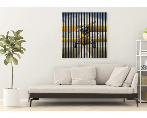 Artă decorativă de perete cu motiv de aeronavă deasupra unei canapele