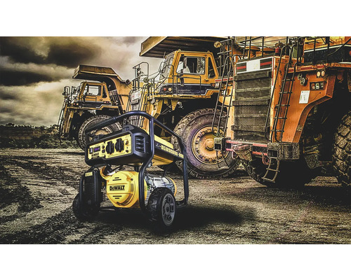 Generator de curent DeWALT în fața basculelor pe un șantier