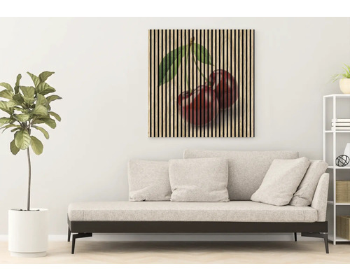 Tablou de perete cu motiv de cireșe deasupra unei canapele în camera de zi