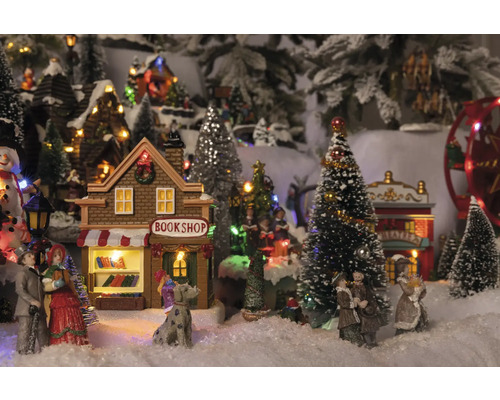 Scenă de sat de Crăciun cu librărie, teatru, figurine și copaci