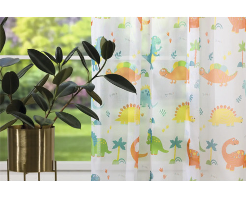 Șaluri decorative cu motiv dinozaur în fața unei ferestre cu o plantă de apartament