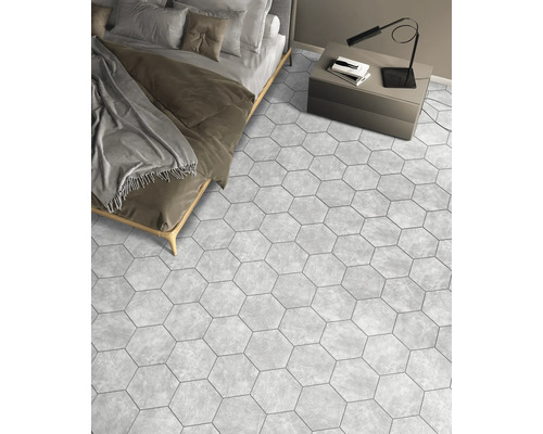 Dormitor cu pat, noptieră și gresie hexagonală