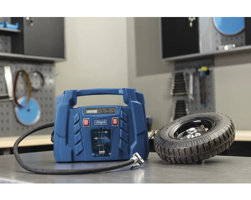 Sigla Scheppach și compresor albastru lângă roată